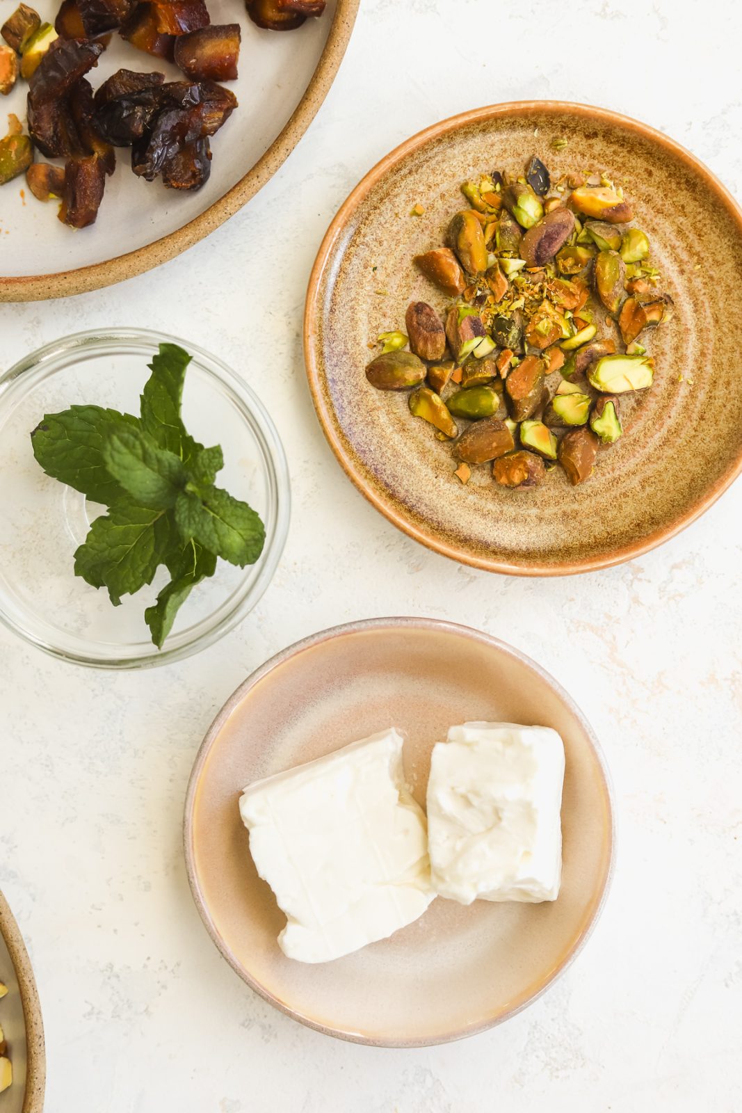 chopped pistachios, feta and mint in prep bowls