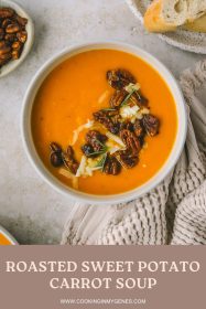 a bowl of sweet potato soup topped with buttery pecans and sharp cheddar cheese
