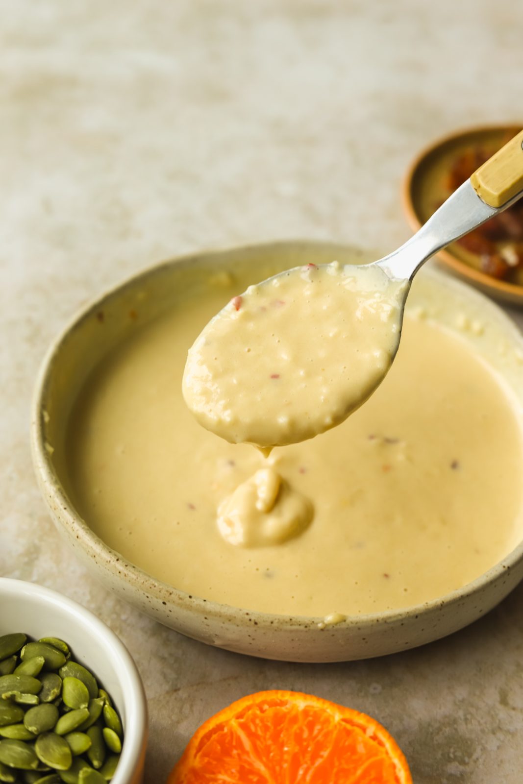 a spoonful of orange tahini sauce