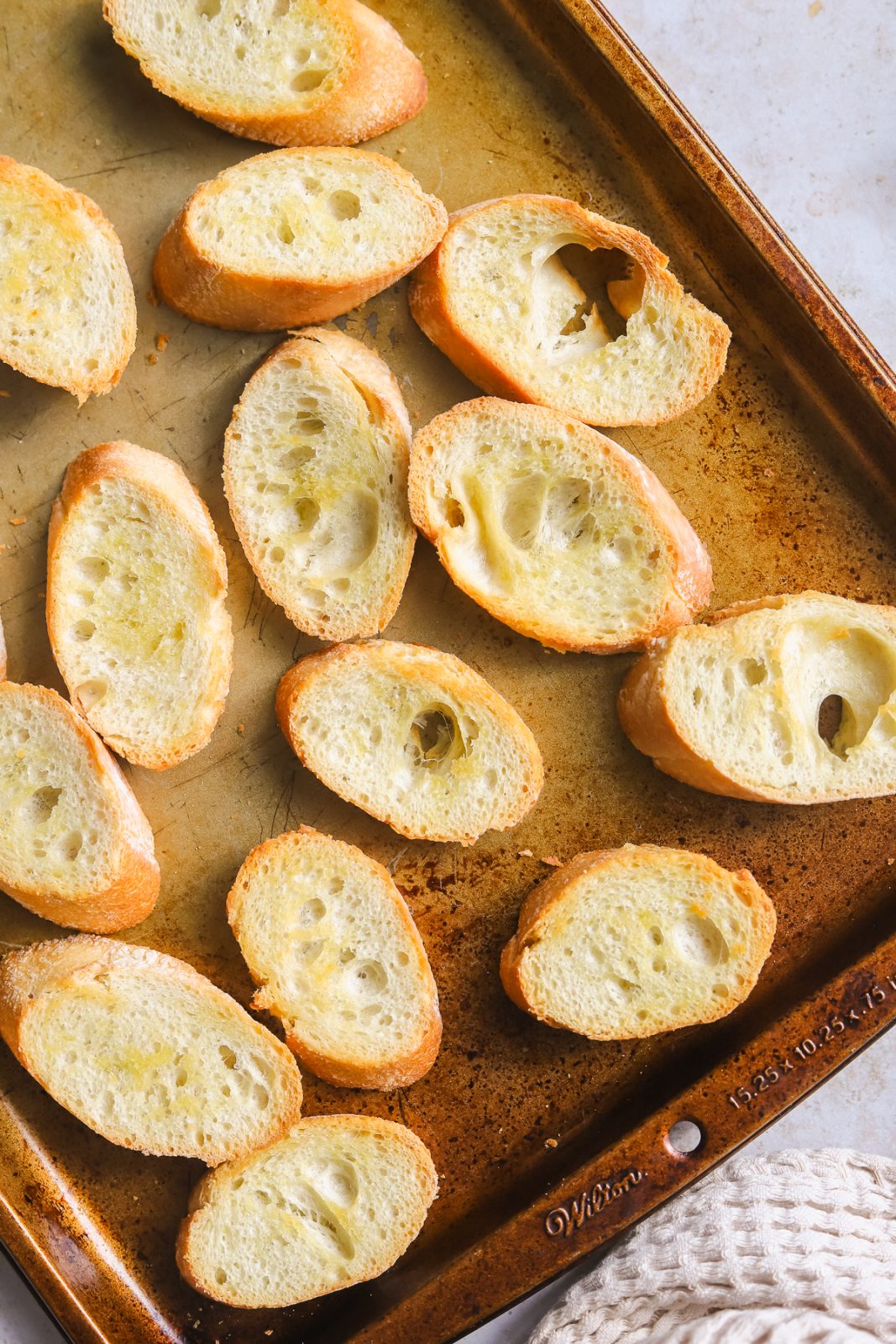 toasted crostini on a baking sheet